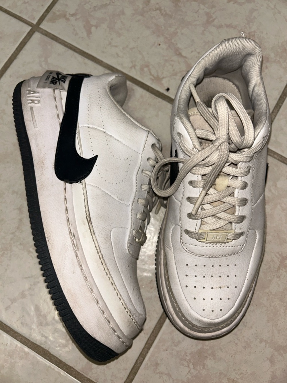 Nike White Sneakers with Black Swoosh